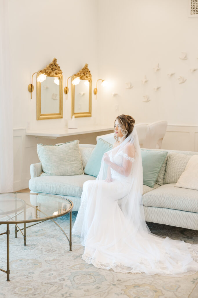 Bride sits in the bridal suite at The Gardenia venue in Dallas
