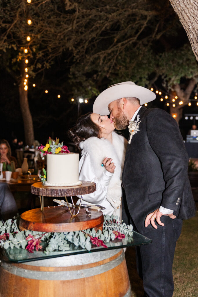 San Antonio wedding cake is being cut by the bride and groom on their wedding night